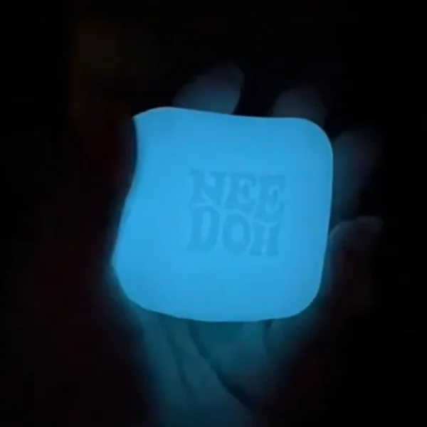 Luminous milk coffee cube Needoh squishy fidget on a desk — Image 2 of 7