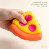 p02_p02_71bX2E28OVL_AC_SL1500_jpg-1.webp NeeDoh Pizza Squeezza fidget toy with peelable cheese and pepperoni toppings