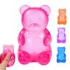 p04_71YYmDDwarL_jpg_v_1782664700-1.jpg Blue NeeDoh Gummy Bear Taba Squishy jelly squeeze toy in hand
