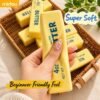 Slow-rise squishy toy shaped like a realistic butter stick, made by NeeDoh