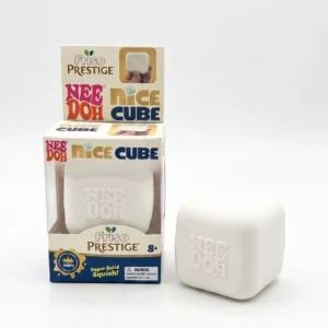 Luminous Milk Coffee Cube Squishy Fidget (6/7) Luminous milk coffee cube Needoh squishy fidget on a desk — Image 6 of 7