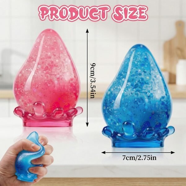 p07_71JR5xnJJQL_70ceea58_a6f2_4293-1.jpg Blue NeeDoh Dream Drop squishy raindrop resting on its clear splash display stand