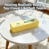 Slow-rise squishy toy shaped like a realistic butter stick, made by NeeDoh