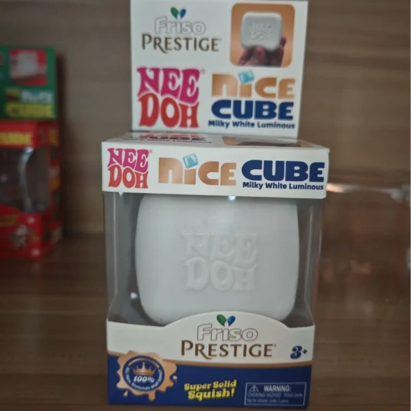 Luminous milk coffee cube Needoh squishy fidget on a desk — Image 7 of 7