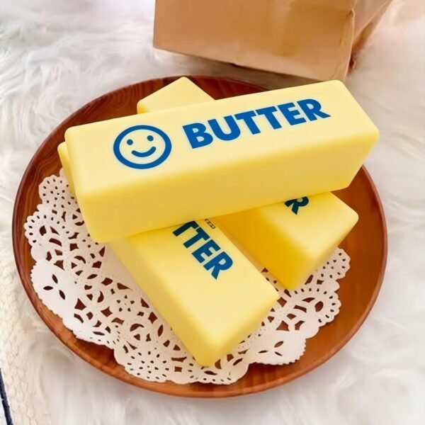 Slow-rise squishy toy shaped like a realistic butter stick, made by NeeDoh